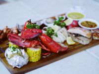 seafood boil platter featuring whole lobster