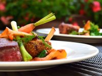 platted steak with baby carrots