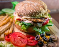 cheeseburger and fries with all the fixings